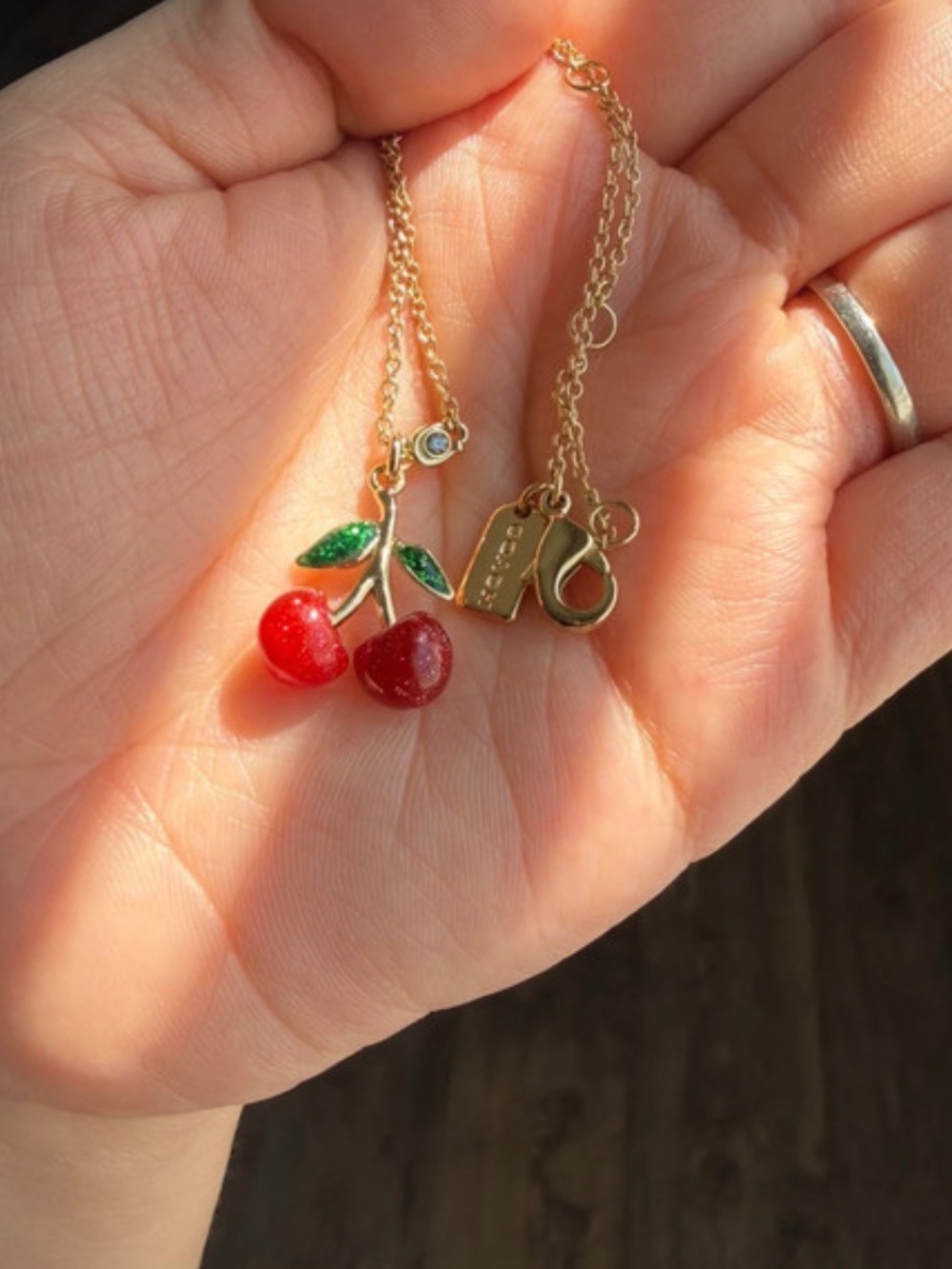 Coach Gold-Tone Cherry Pendant Necklace with Red Enamel